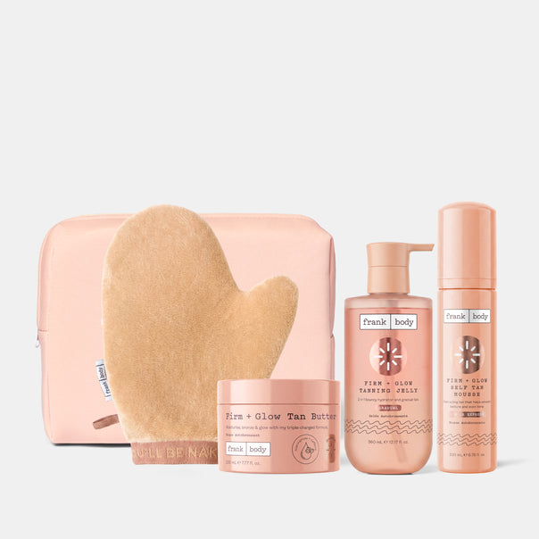 The frank body Bronze With Benefits Kit: Firm + Glow Tan Butter, Tanning Jelly and Self Tan Mousse with a tanning mitt and pink pouch.
