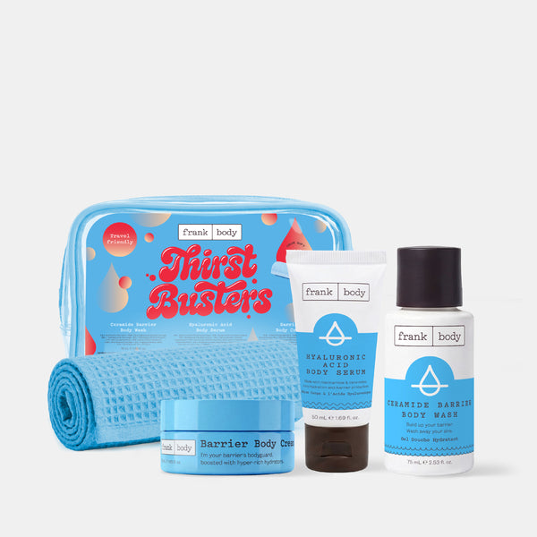 The frank body Thirst Busters Kit with the barrier body cream, hyaluronic body serum and ceramide body wash beside a blue bag and waffle towel on white.