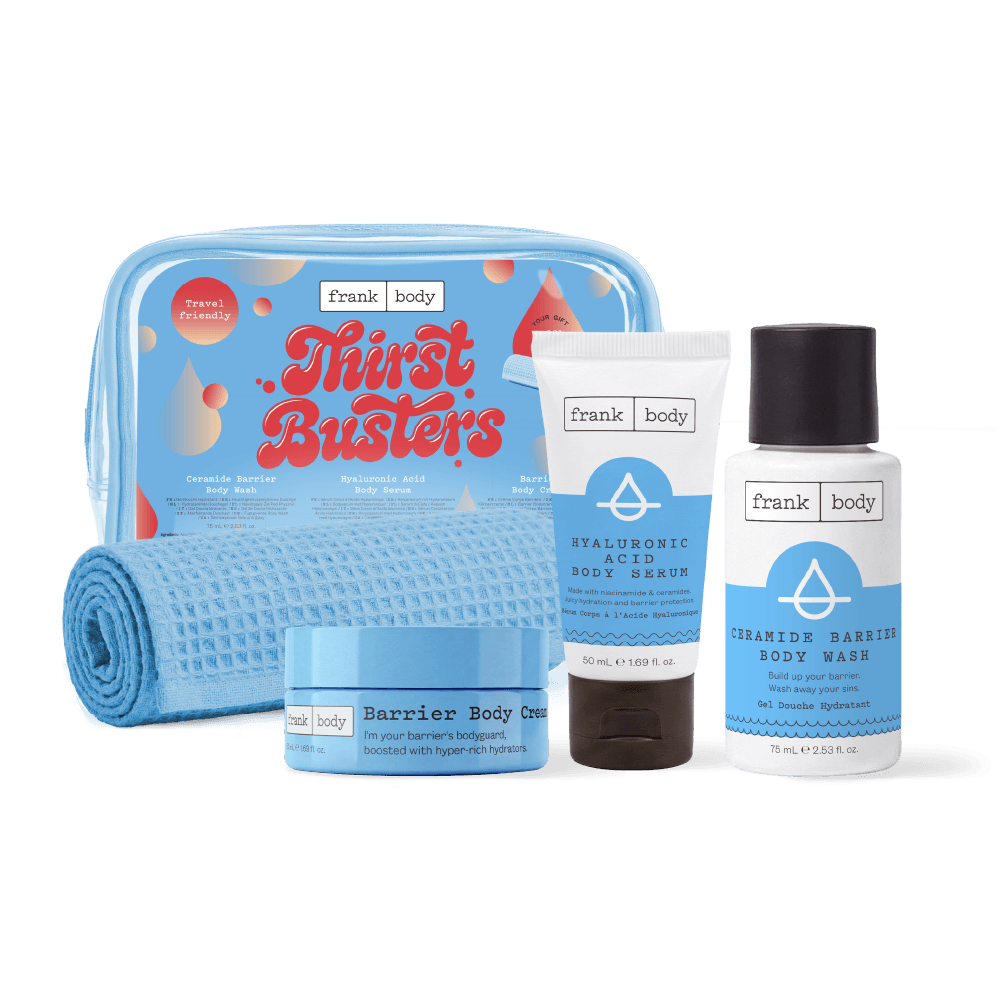The frank body Thirst Busters Kit: a clear blue travel bag and waffle towel with the Barrier Body Creme, Hyaluronic Acid Body Serum and Ceramide Barrier Body Wash.