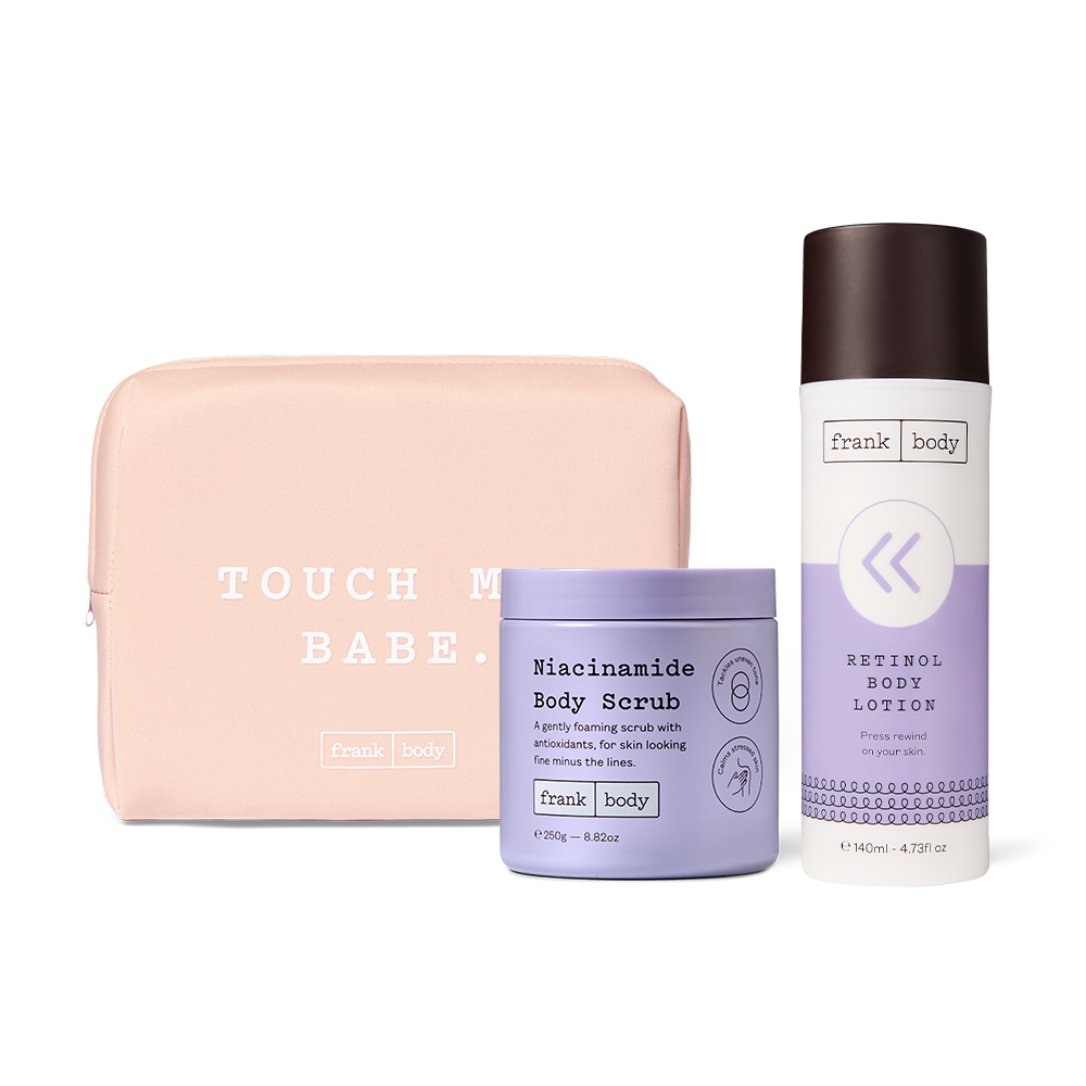 The frank body Rewind Body Duo: Niacinamide Body Scrub and Retinol Body Lotion with a pink Touch Me Babe pouch.