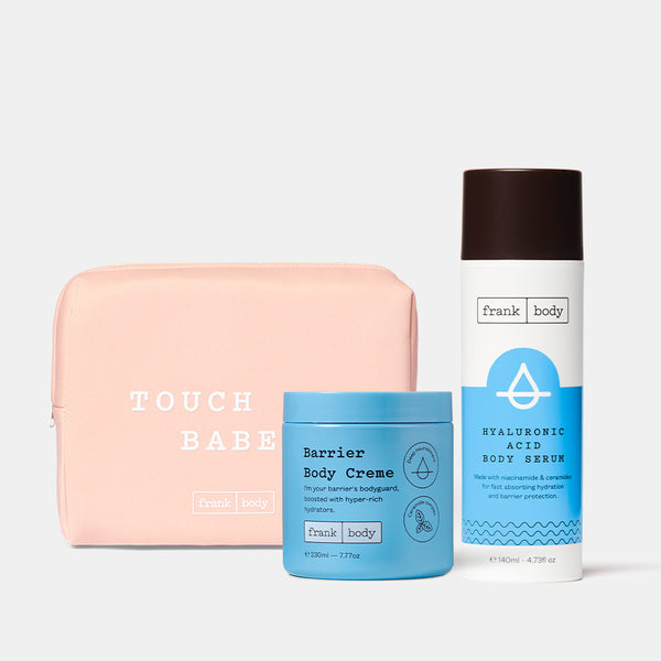 The frank body Juicy Treats Kit: Barrier Body Creme and Hyaluronic Acid Body Serum with a pink Touch Me Babe pouch.